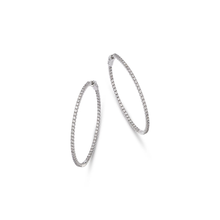 Luxury 14K gold diamond hoop earrings featuring pavé-set diamonds in a timeless and elegant design, available in yellow, white, and rose gold.


