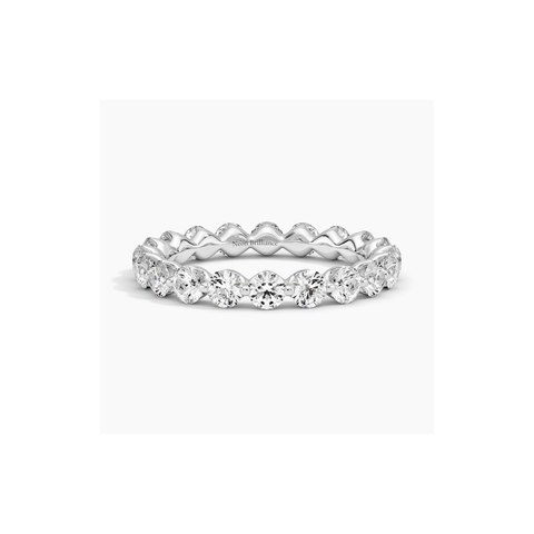 14K gold eternity ring with floating lab-grown diamonds in a delicate prong setting. A luxurious and modern wedding or anniversary band for women.