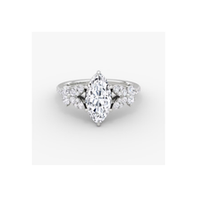 Elegant 14K gold diamond ring with a stunning marquise-cut center stone, surrounded by pavé-set accent diamonds in a timeless and luxurious design.