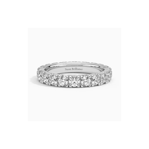 14K gold eternity band with lab-grown diamonds in a prong setting. A luxurious and timeless wedding or anniversary ring for women.