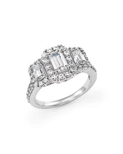 14K white gold diamond halo ring with emerald-cut lab-grown diamonds, featuring a triple halo pavé setting, perfect for bridal and fine jewelry collections.
