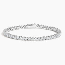 A stunning 14K gold diamond tennis bracelet featuring pavé-set teardrop diamonds, available in white, yellow, or rose gold. Luxury fine jewelry for women.

