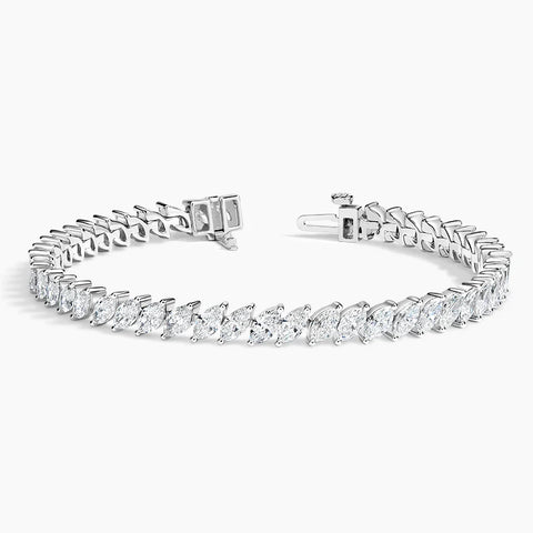Luxury 14K gold marquise diamond tennis bracelet with ethically sourced diamonds. Elegant, handcrafted fine jewelry perfect for special occasions.