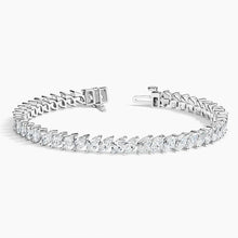 Luxury 14K gold marquise diamond tennis bracelet with ethically sourced diamonds. Elegant, handcrafted fine jewelry perfect for special occasions.