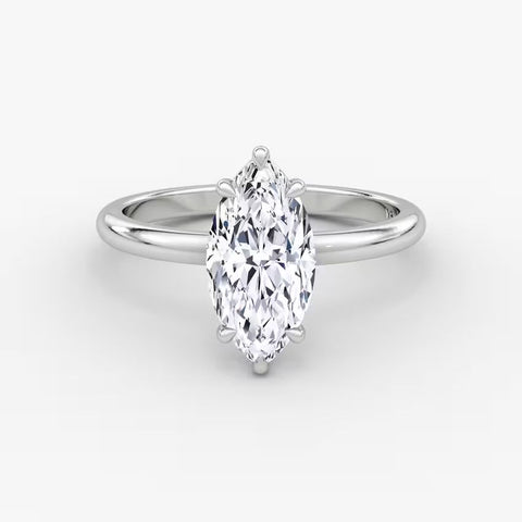 Elegant marquise diamond ring in 14K gold with pavé-set halo and cluster side accents, available in yellow, white, rose gold, or platinum.

