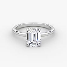 14K gold emerald-cut diamond band with center stone in a timeless setting